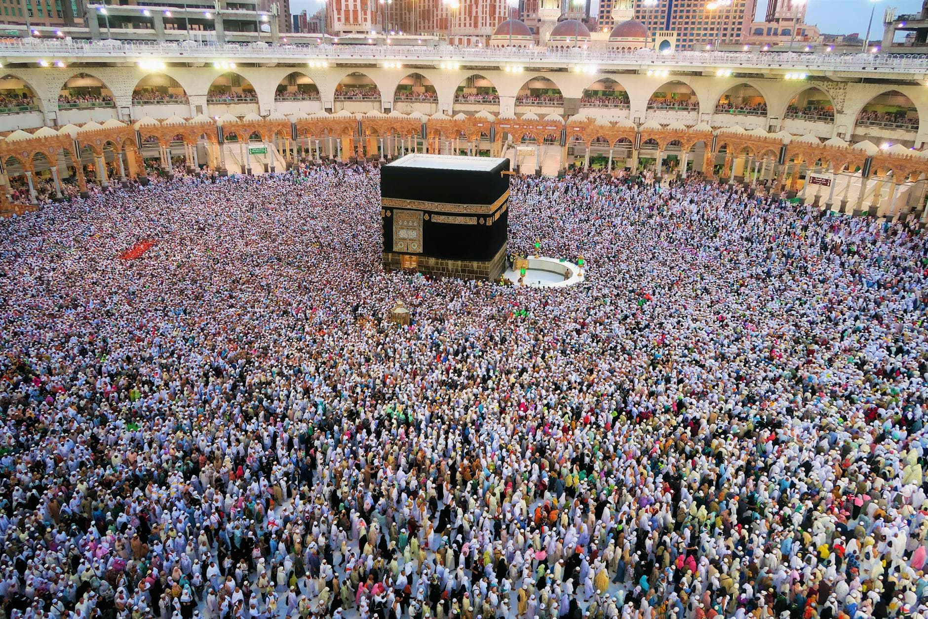 Photo by Konevi on Pexels Aerial view of a large crowd of pilgrims gathered around the Kaaba in Mecca for religious rituals.